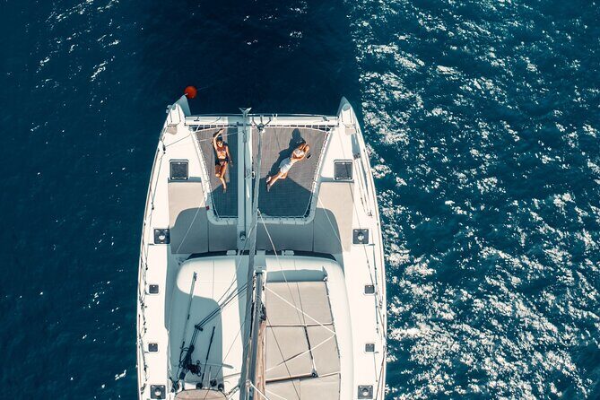 Beautiful Day Catamaran Caldera Cruise incl. Meal & Drinks - What’s included: BBQ, open bar, and snorkeling gear on board