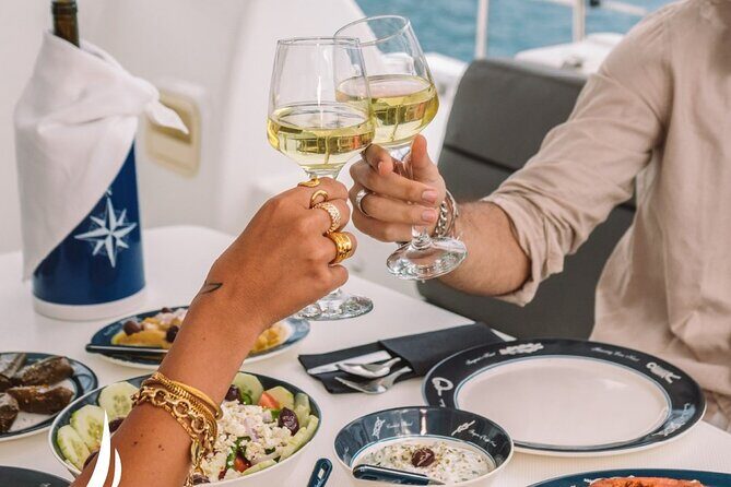 Private Sunset Cruise with Full Greek Dinner - Catamaran comfort: towels, jackets, and snorkeling gear