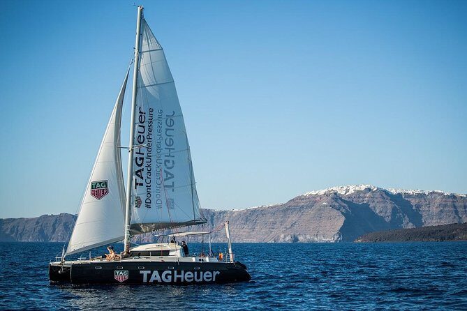 Santorini: Adventurous Catamaran Experience with Snorkeling - Black Mountain snorkeling: clear water and a true swim stop