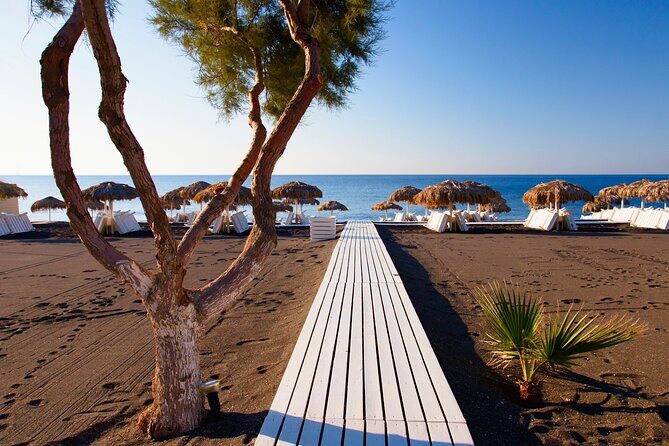 Santorini In One Day Bus Tour with Oia Sunset & optional Sailing - Red Beach: quick photos, volcanic drama, and limited time