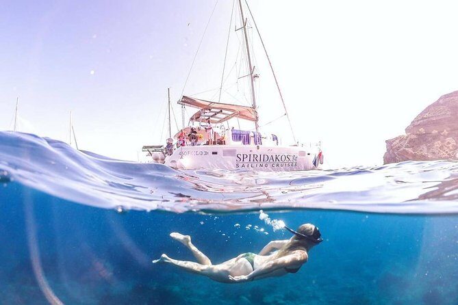 Santorini Private Catamaran Cruise with BBQ, Open Bar & Transfers - Red Beach at Akrotiri: your iron-mineral photo stop