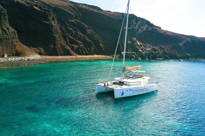 Santorini Private Catamaran Cruise with BBQ, Open Bar & Transfers - Mesa Pigadia Bay: an on-board swim or relax session
