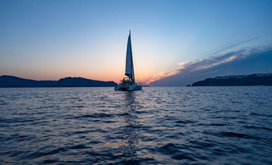 Santorini: Private Sunset Cruise with Dinner and Drinks - Red, White, Black beaches and the lighthouse dinner moment