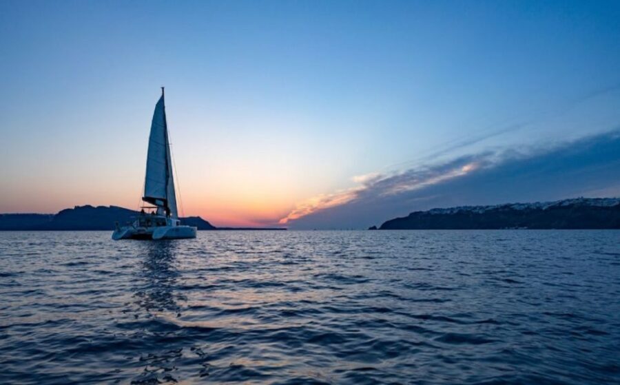 Santorini: Private Sunset Cruise with Dinner and Drinks - From Ammoudi port to Thirassia: the caldera cliffs start the show